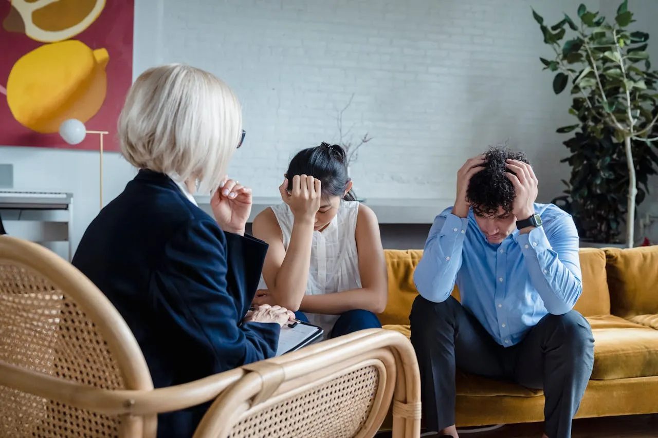 Midlife couple in counseling, navigating menopause-related marital strain