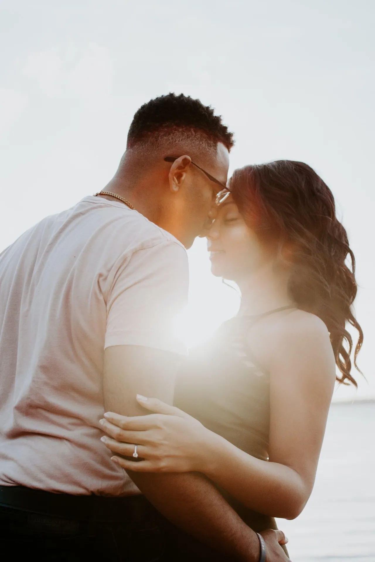 Couple embracing at golden hour